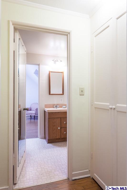44 San Miguel Road Pasadena, CA 91105 - Photo 14 of 18 a en suite bathroom with a sink and a mirror
