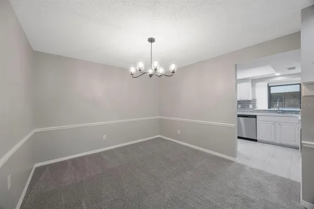 a kitchen with a sink and a refrigerator