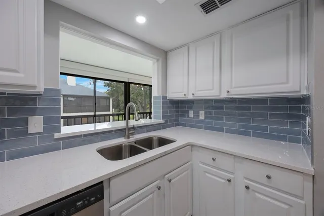 a view of an empty room with windows