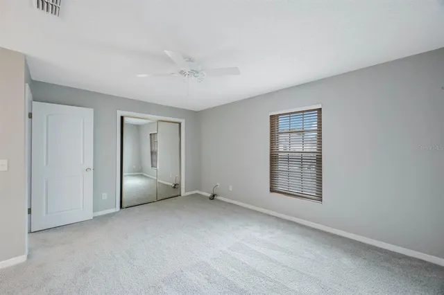a white bath tub sitting next to a toilet