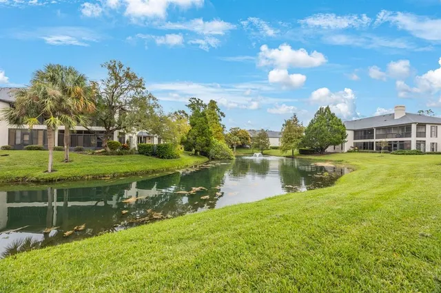 a view of a lake with a house in the background