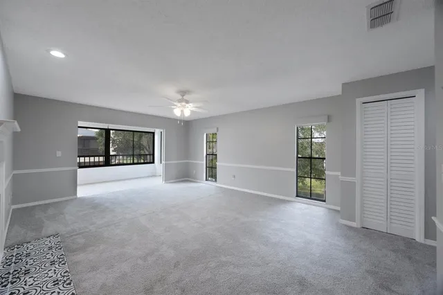 an empty room with a kitchen and a sink