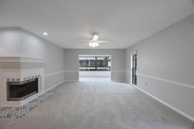 an empty room with windows and entrance