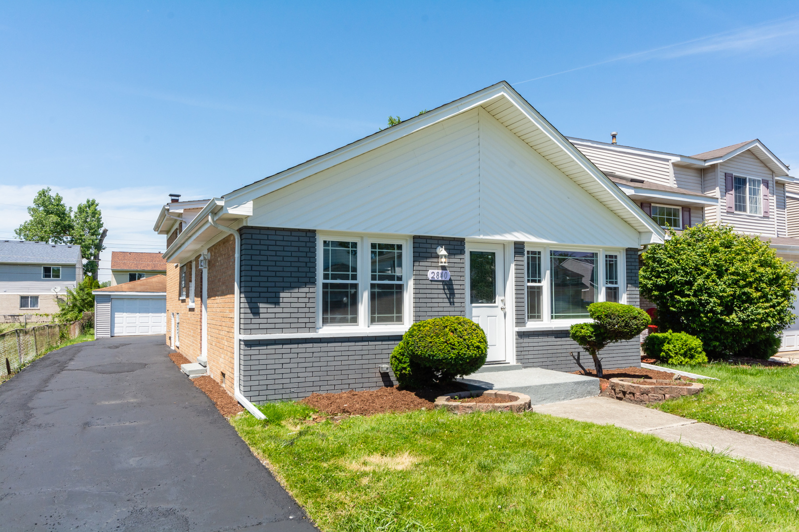 2840 140th Street Blue Island, IL 60406 - Photo 1 of 16 a front view of a house with garden