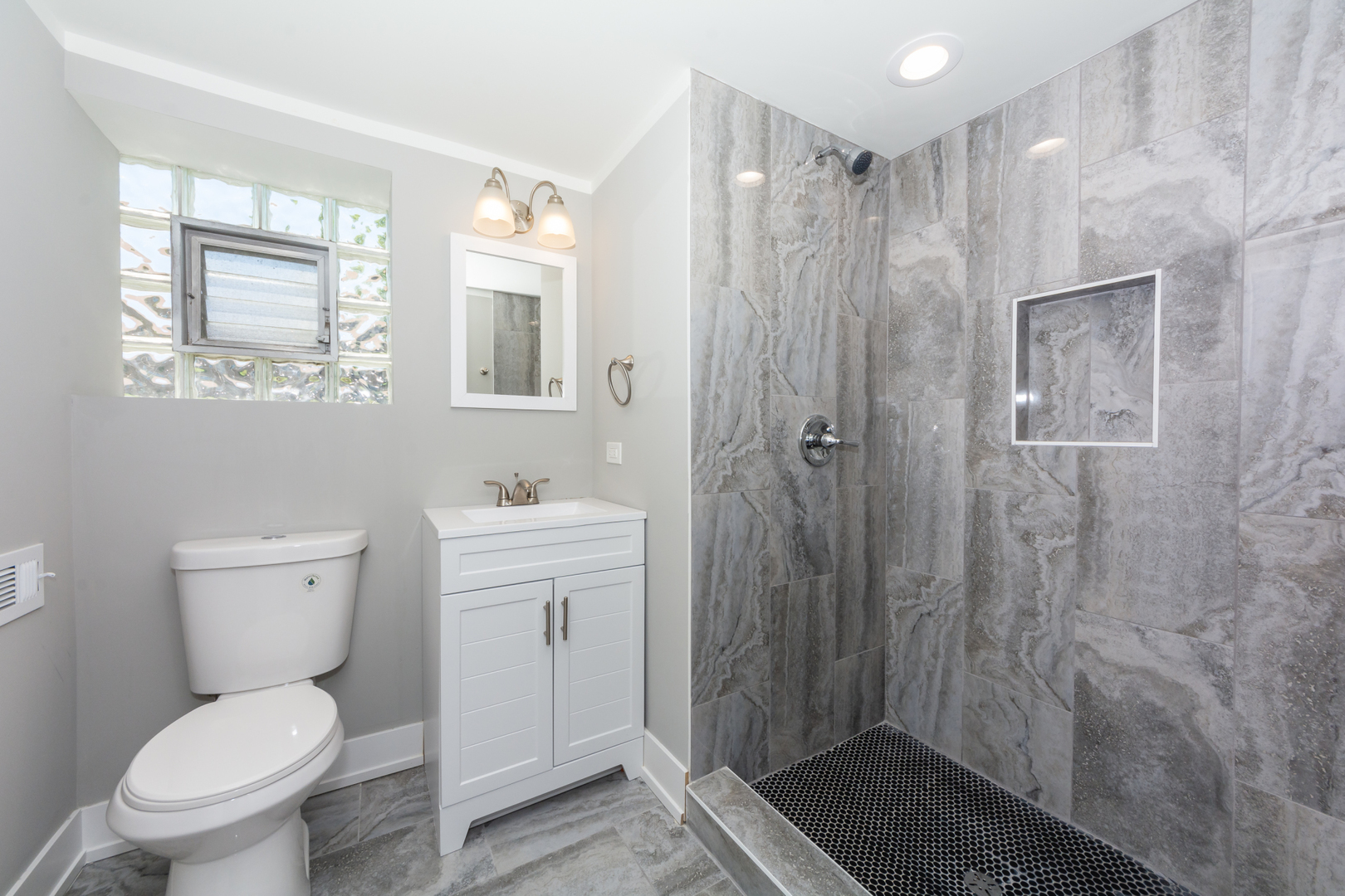 2840 140th Street Blue Island, IL 60406 - Photo 15 of 16 a bathroom with a toilet a sink and shower