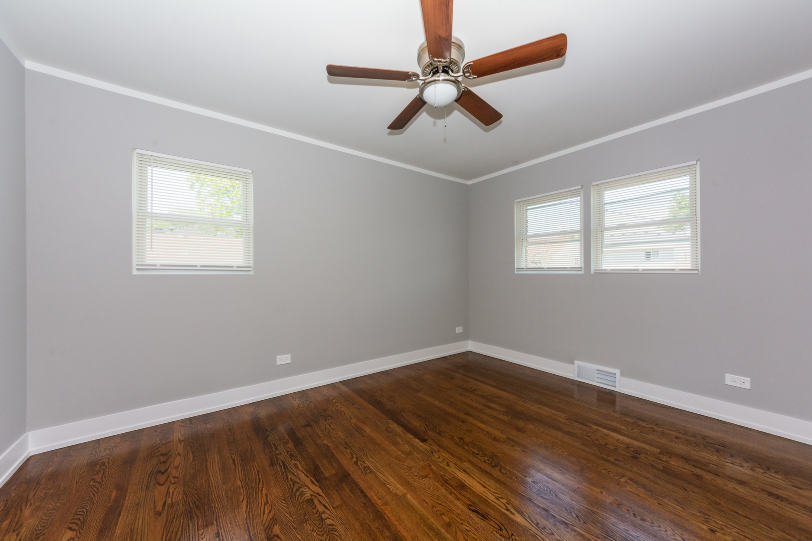2840 140th Street Blue Island, IL 60406 - Photo 3 of 16 a view of empty room with wooden floor and fan