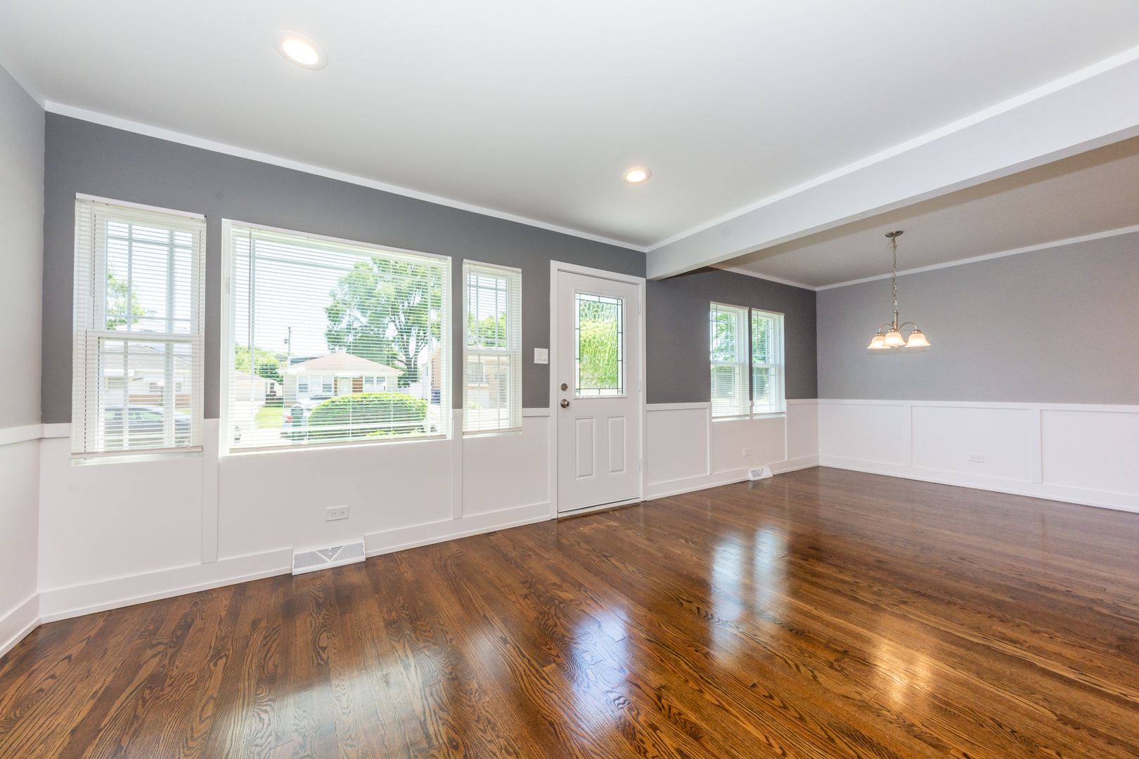 2840 140th Street Blue Island, IL 60406 - Photo 4 of 16 a view of an empty room with wooden floor and a window