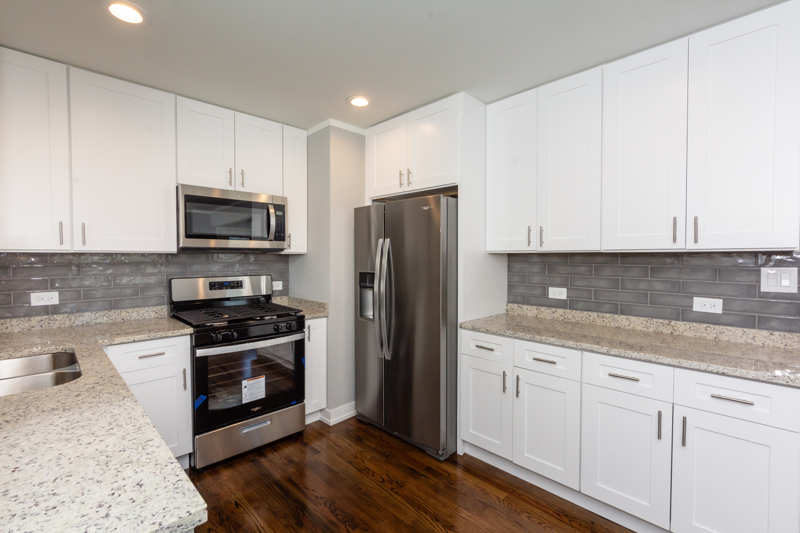 2840 140th Street Blue Island, IL 60406 - Photo 6 of 16 a kitchen with stainless steel appliances granite countertop a stove a sink and a refrigerator