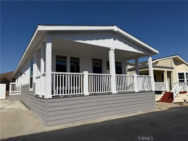 a view of a house with a small yard