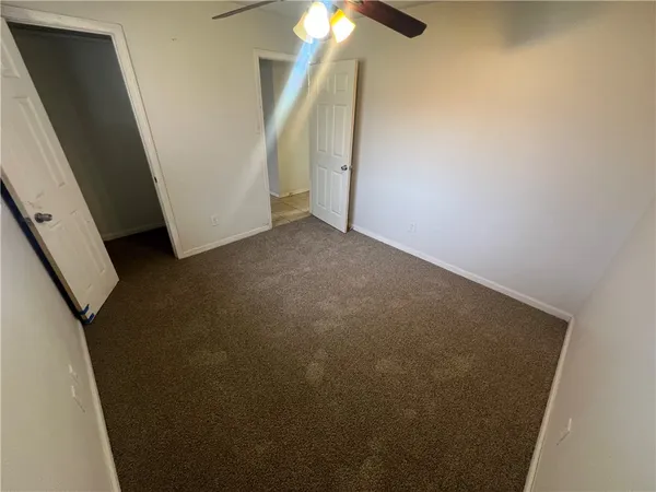 a bathroom with a sink toilet vanity and tub