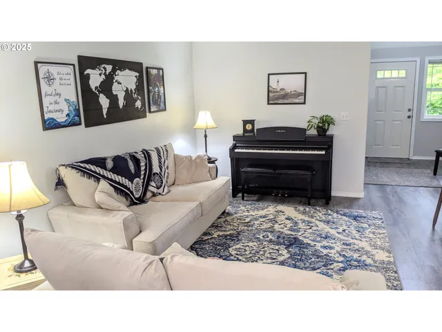 a living room with furniture and a rug