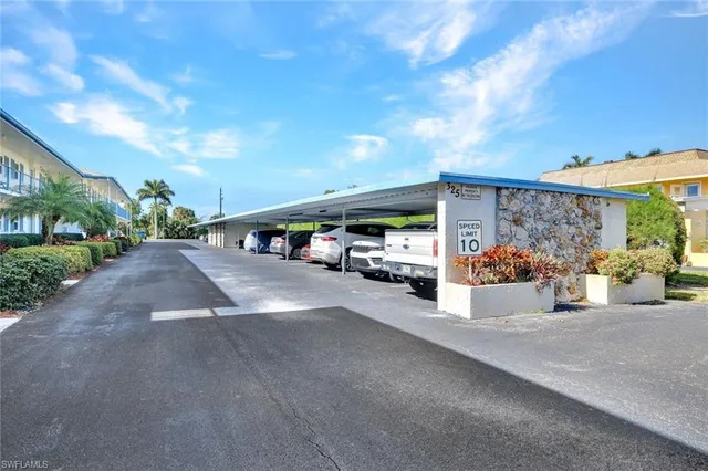 a view of street with parked cars