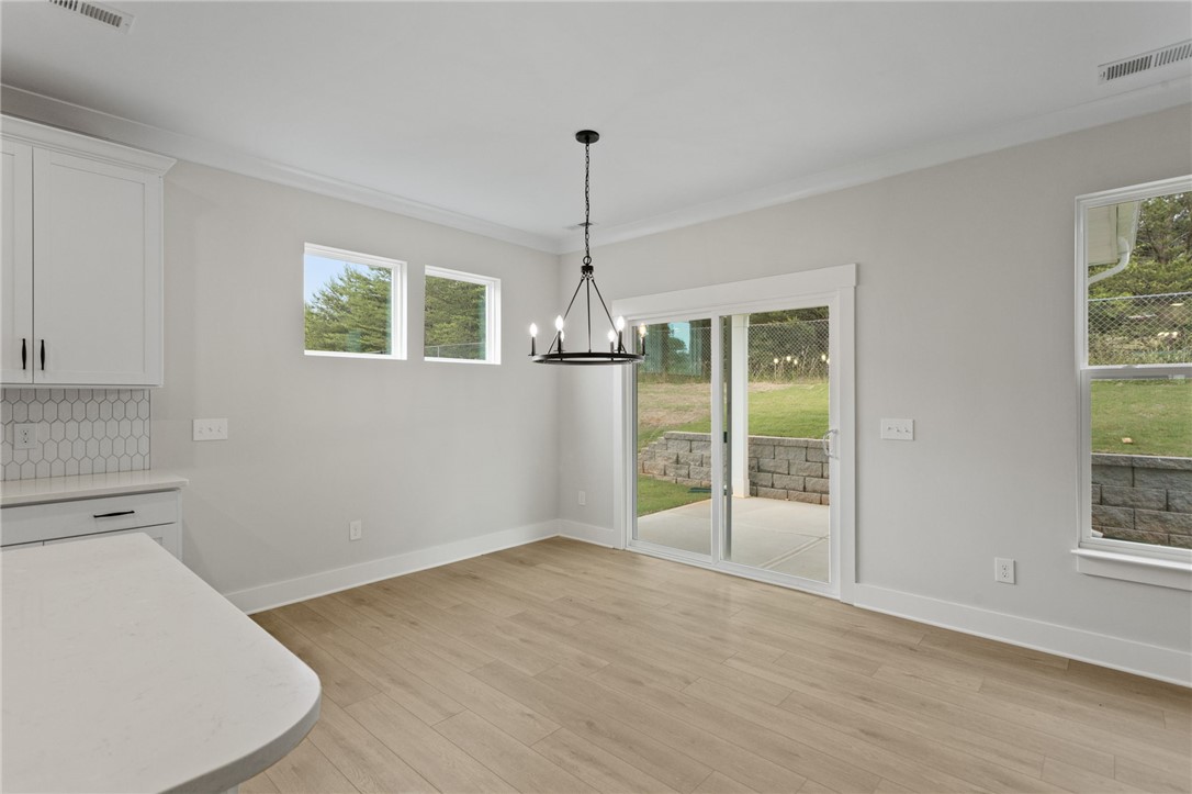 313 Old Shirley Road Central, SC 29630 - Photo 8 of 30 This bright, open space features sleek flooring and expansive sliding glass doors.