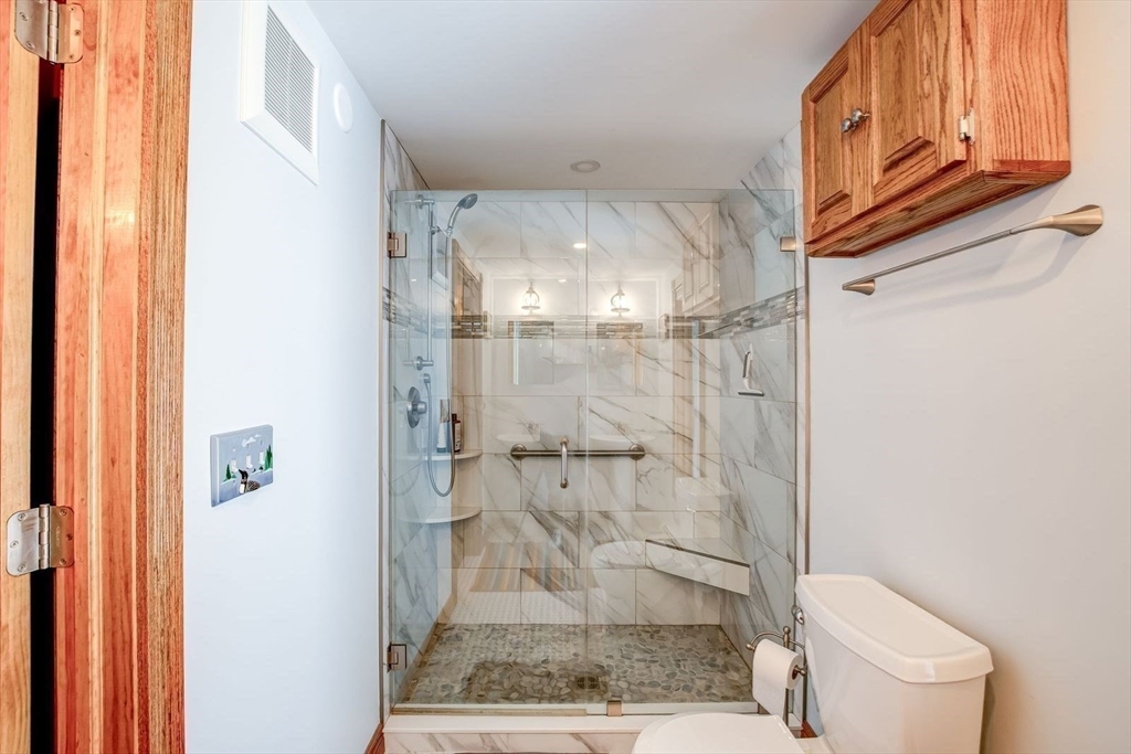 205 East Rindge Road Ashburnham, MA 01430 - Photo 25 of 40 a bathroom with a granite countertop shower and a toilet