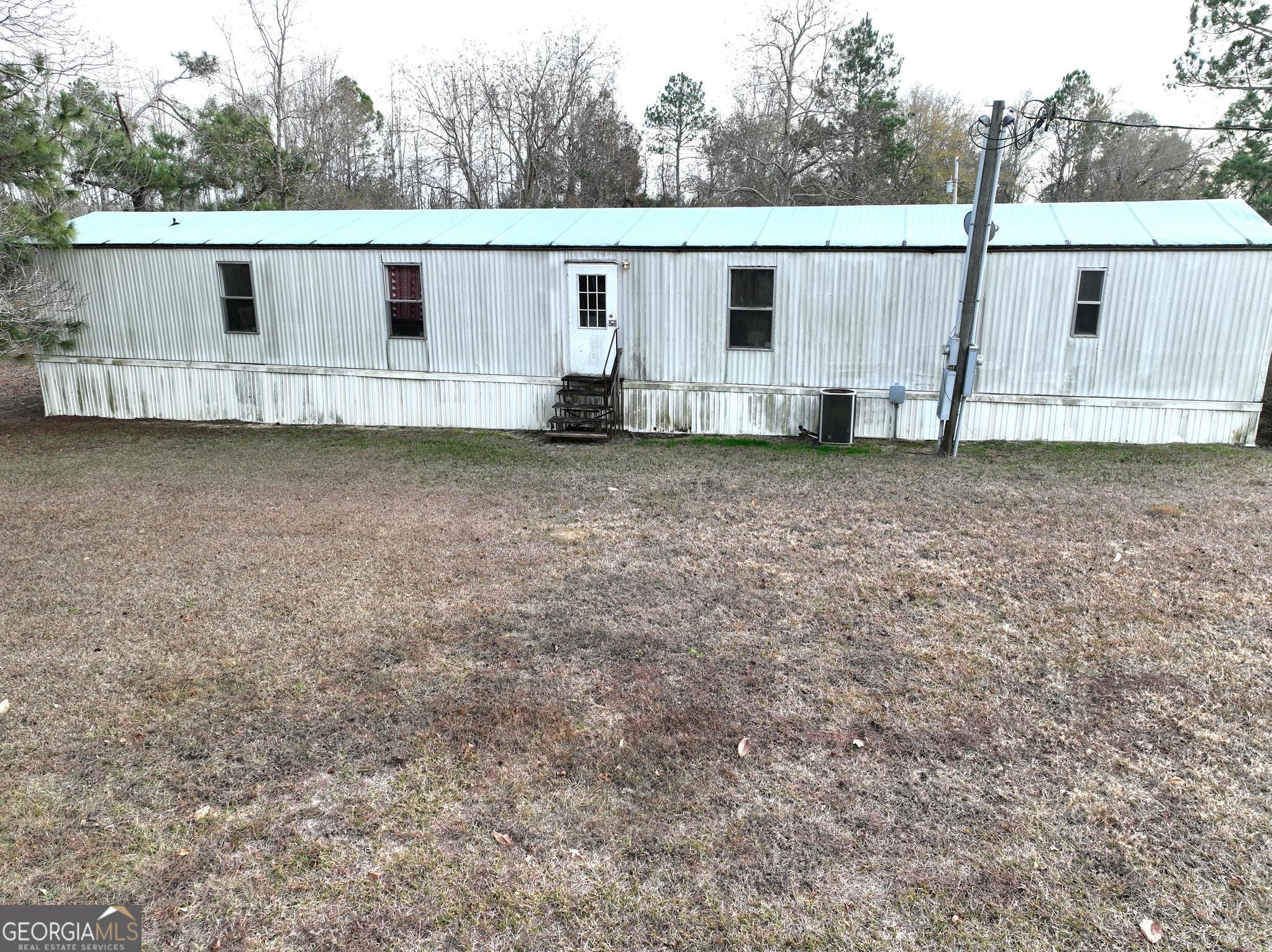1500 Mallard Road Cobbtown, GA 30420 - Photo 16 of 20 a view of a backyard with white house
