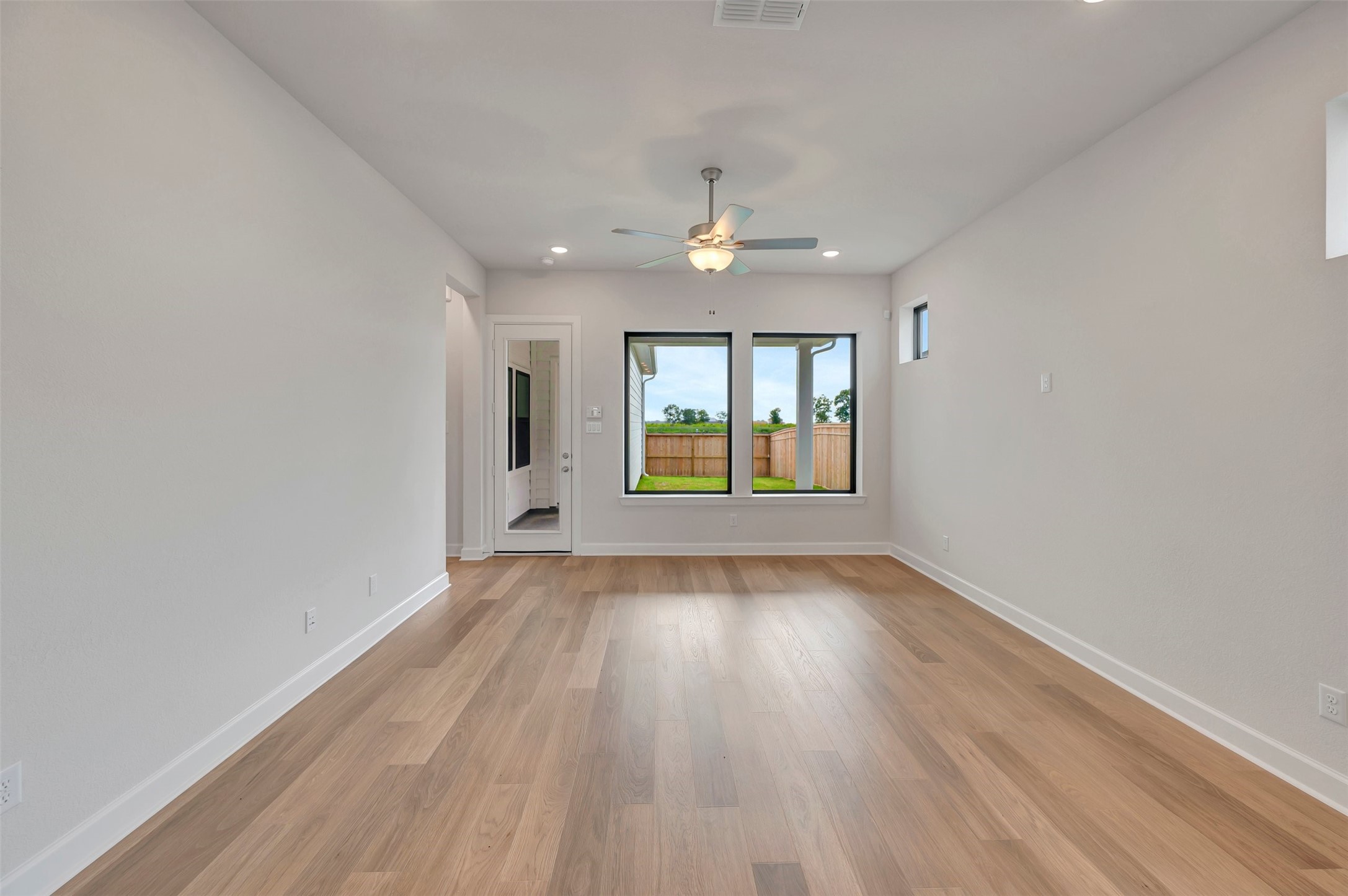2718 Cottage Place Rosharon, TX 77583 - Photo 28 of 50 wooden floor in an empty room with a window