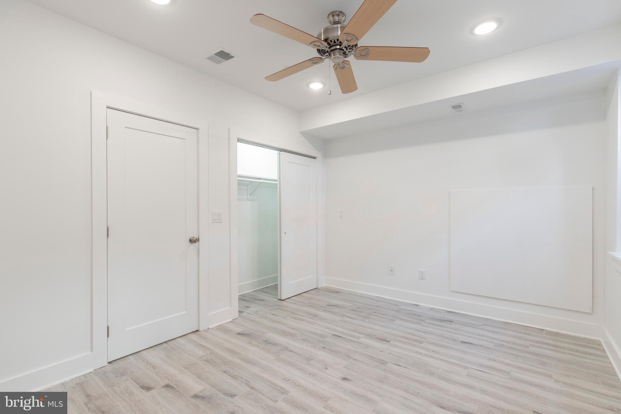 2412 Master Street, Unit A Philadelphia, PA 19121 - Photo 17 of 25 wooden floor in an empty room