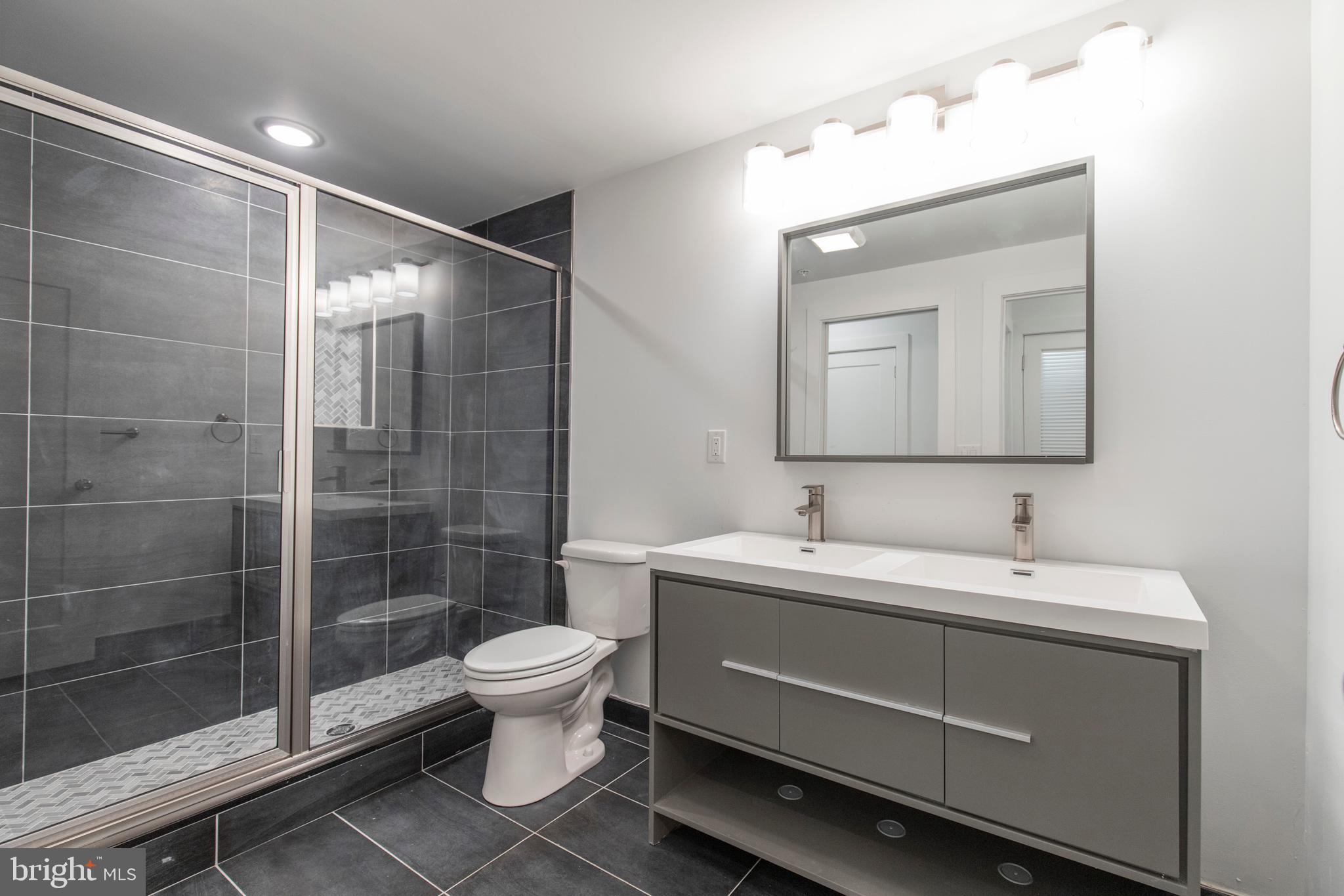 2412 Master Street, Unit A Philadelphia, PA 19121 - Photo 21 of 25 a bathroom with a toilet sink and shower