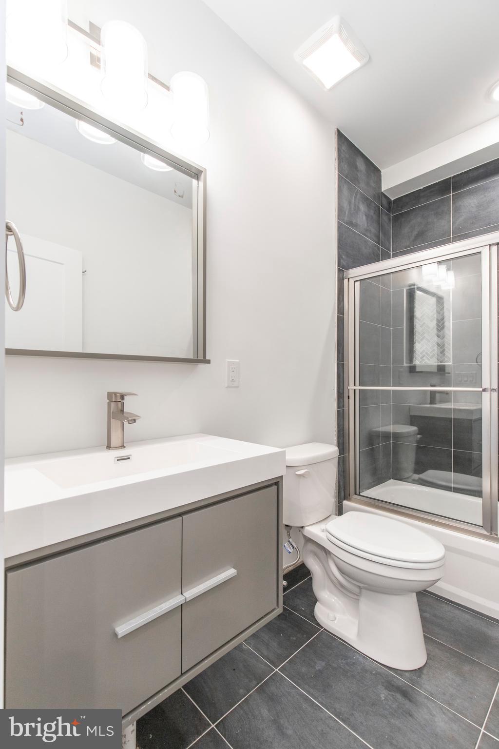 2412 Master Street, Unit A Philadelphia, PA 19121 - Photo 10 of 25 a bathroom with a sink toilet and shower