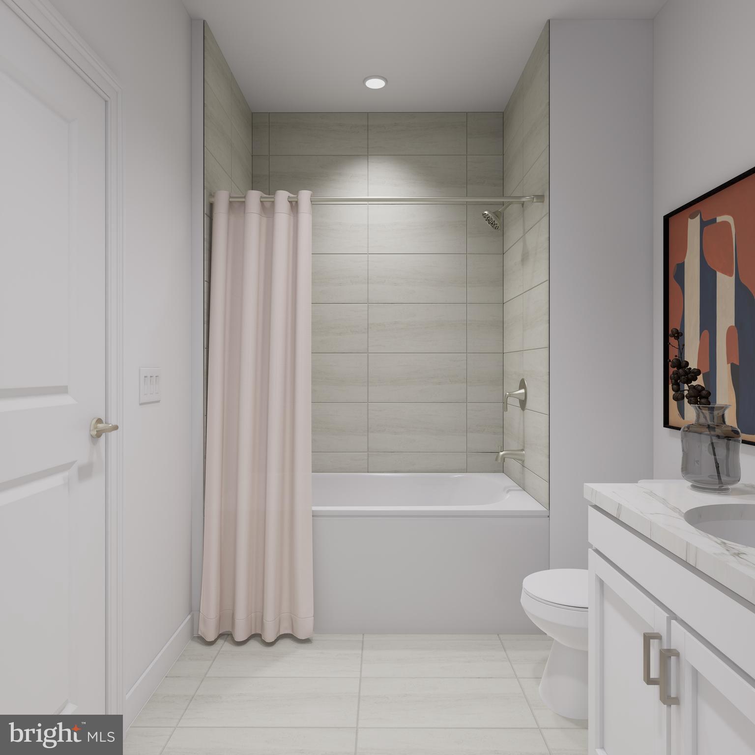 83 Bethlehem Pike, Unit 1109 Colmar, PA 18915 - Photo 14 of 19 a bathroom with a granite countertop bathtub shower sink vanity and toilet