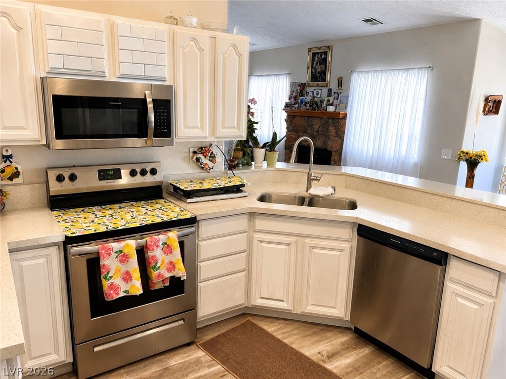 200 East Gamebird Road Pahrump, NV 89048 - Photo 7 of 23 A well-appointed kitchen features stainless steel appliances and a dual-basin sink, ready for any culinary endeavor.