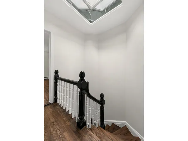a bathroom with a granite countertop sink mirror and bathtub