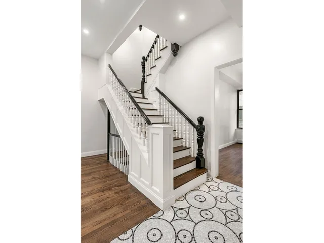a picture of a rug with a white wall