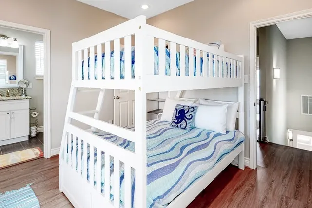 a bedroom with furniture and a window