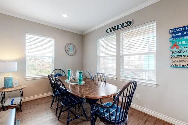 a view of a dining room with furniture and window