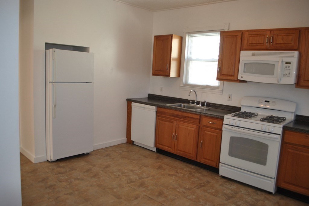 40 I Street, Unit 3 Boston, MA 02127 - Photo 3 of 11 a kitchen with sink a microwave and cabinets