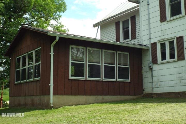 3492 South Eby's Mill Road Elizabeth, IL 61028 - Photo 15 of 20 a front view of a house with a yard
