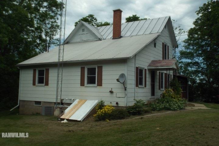 3492 South Eby's Mill Road Elizabeth, IL 61028 - Photo 17 of 20 a front view of house with yard and green space