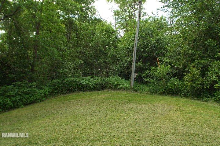 3492 South Eby's Mill Road Elizabeth, IL 61028 - Photo 19 of 20 a view of a green field with a tree