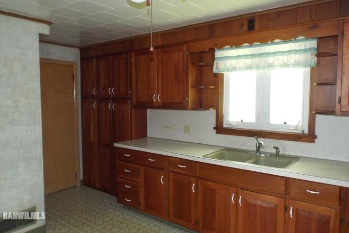 3492 South Eby's Mill Road Elizabeth, IL 61028 - Photo 3 of 20 a bathroom with a sink and a mirror