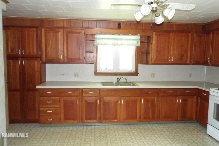 3492 South Eby's Mill Road Elizabeth, IL 61028 - Photo 4 of 20 a kitchen with cabinets and chandelier
