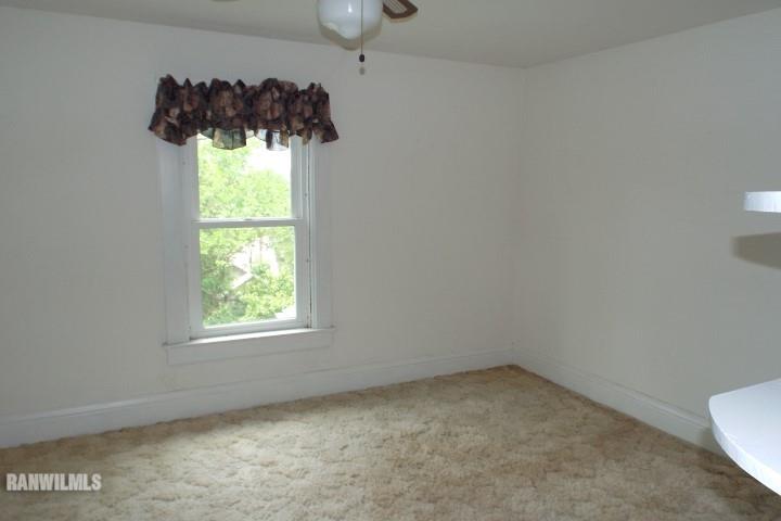 3492 South Eby's Mill Road Elizabeth, IL 61028 - Photo 9 of 20 an empty room with a window