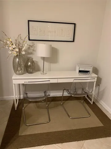 a room with a table and a mirror