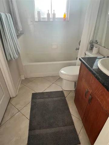 a bathroom with a sink and toilet