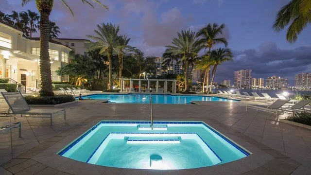 a view of swimming pool with outdoor seating