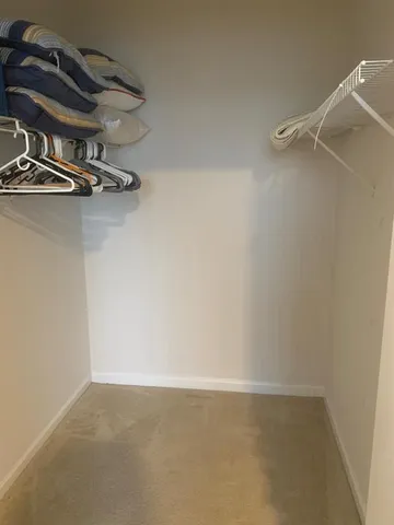 an empty room with a ceiling fan