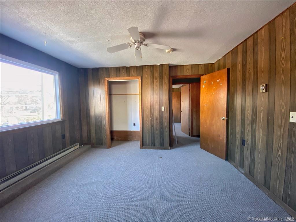 57 Main Street Winchester, CT 06098 - Photo 15 of 27 an empty room with windows and closet