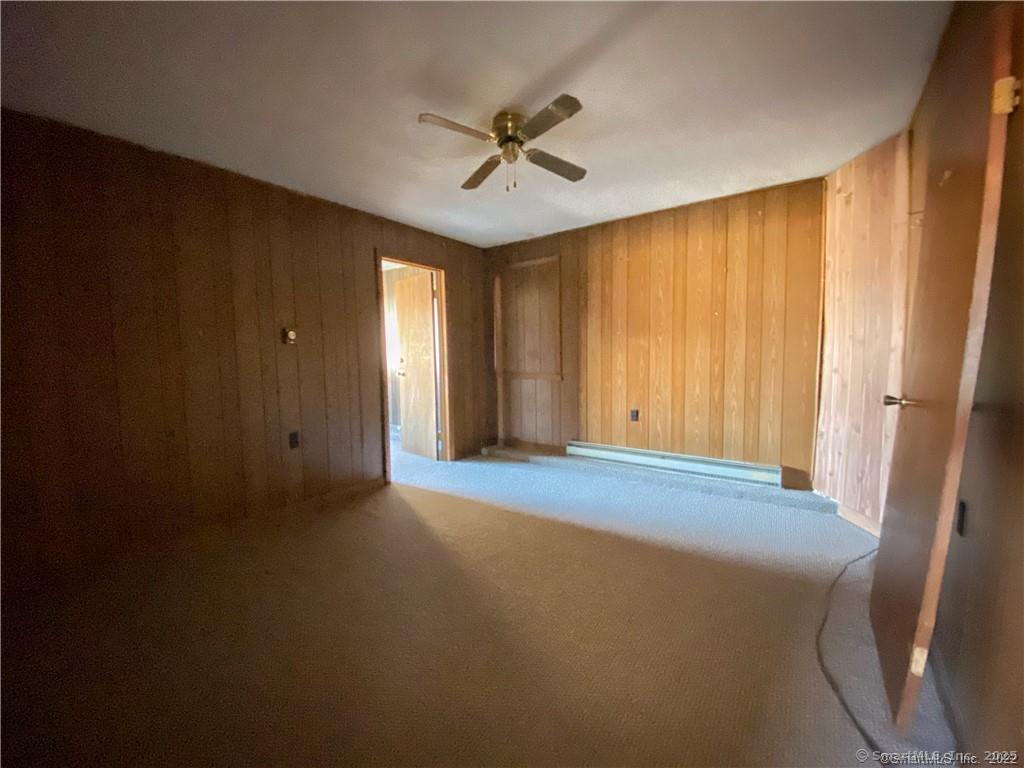 57 Main Street Winchester, CT 06098 - Photo 17 of 27 a view of a livingroom with a ceiling fan and window