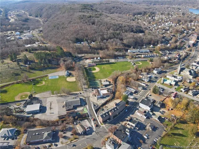 an aerial view of a city with ocean view