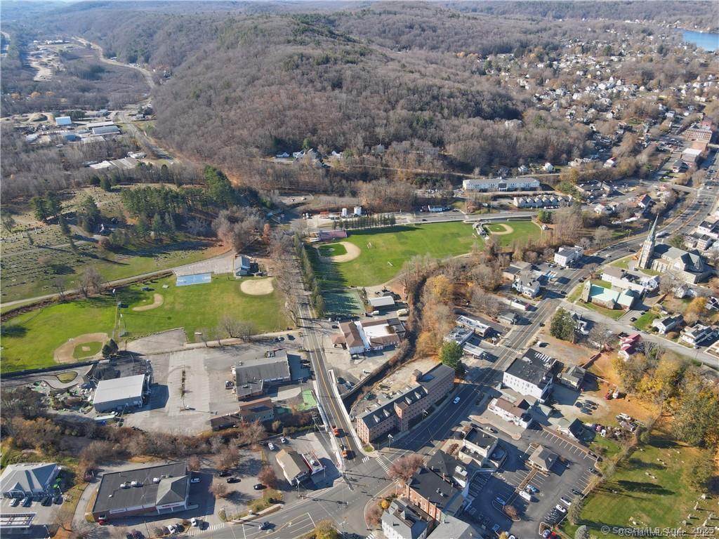 57 Main Street Winchester, CT 06098 - Photo 2 of 27 an aerial view of a city with ocean view