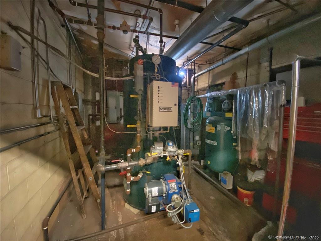 57 Main Street Winchester, CT 06098 - Photo 22 of 27 a view of a room with gym equipment