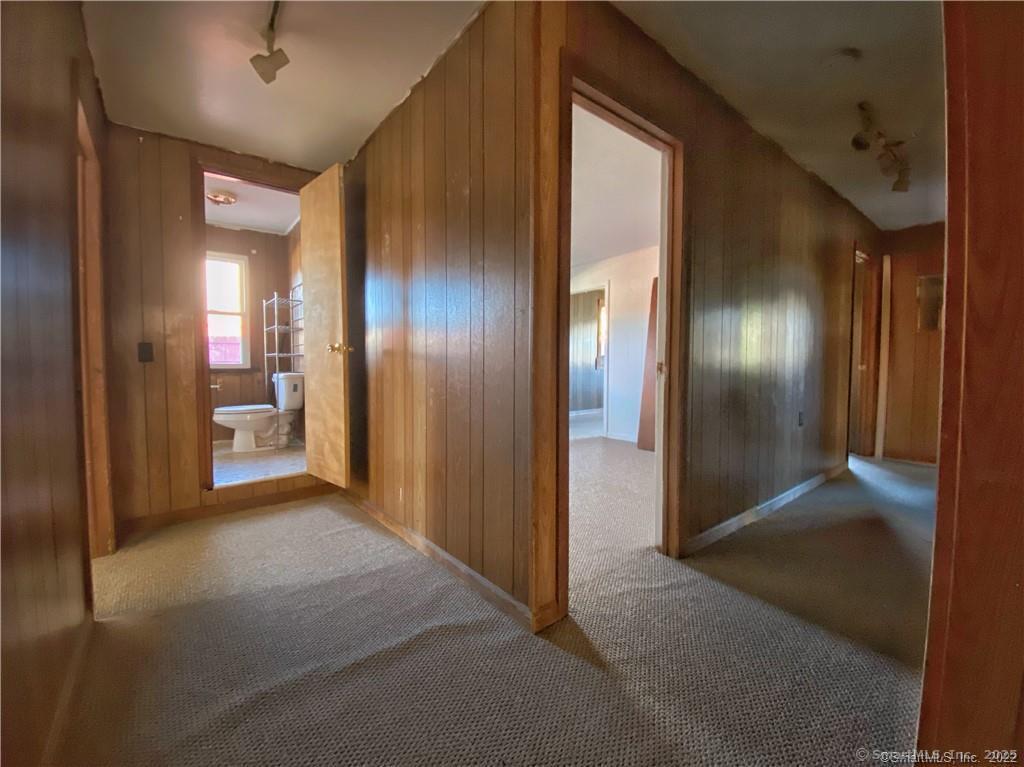 57 Main Street Winchester, CT 06098 - Photo 25 of 27 a view of a hallway with wooden shelves
