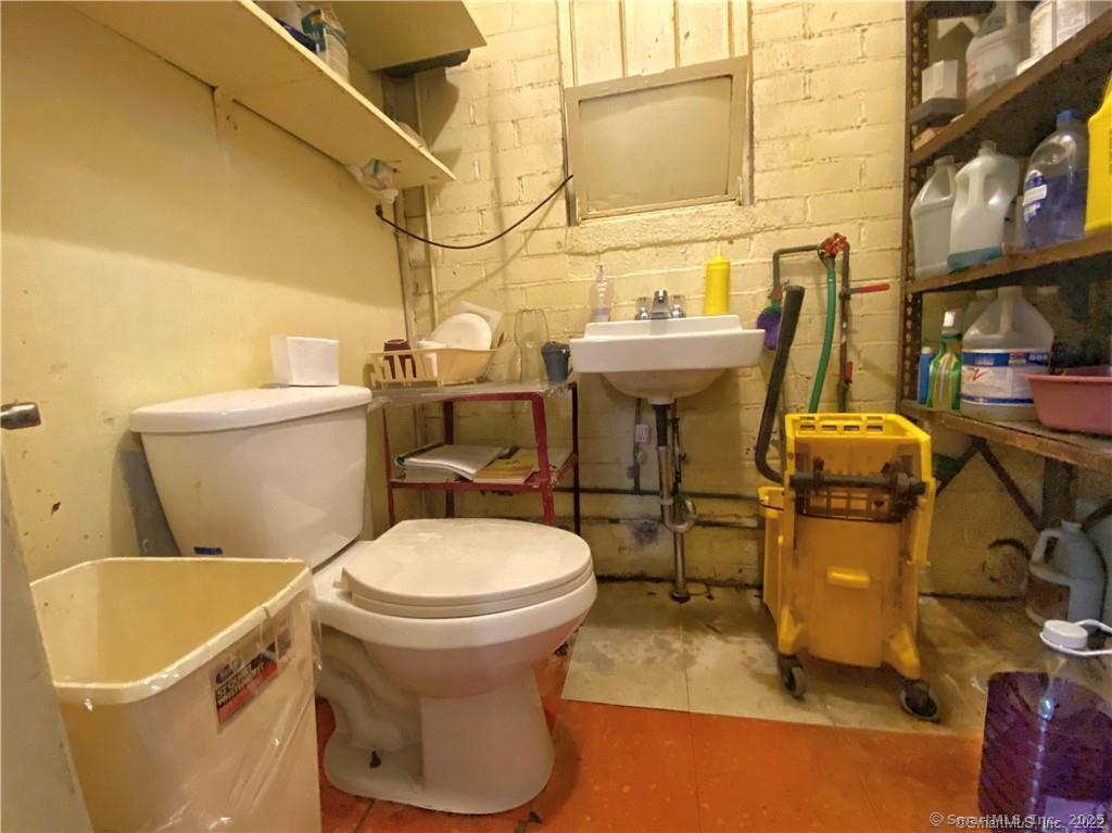 57 Main Street Winchester, CT 06098 - Photo 9 of 27 a bathroom with a sink and a toilet