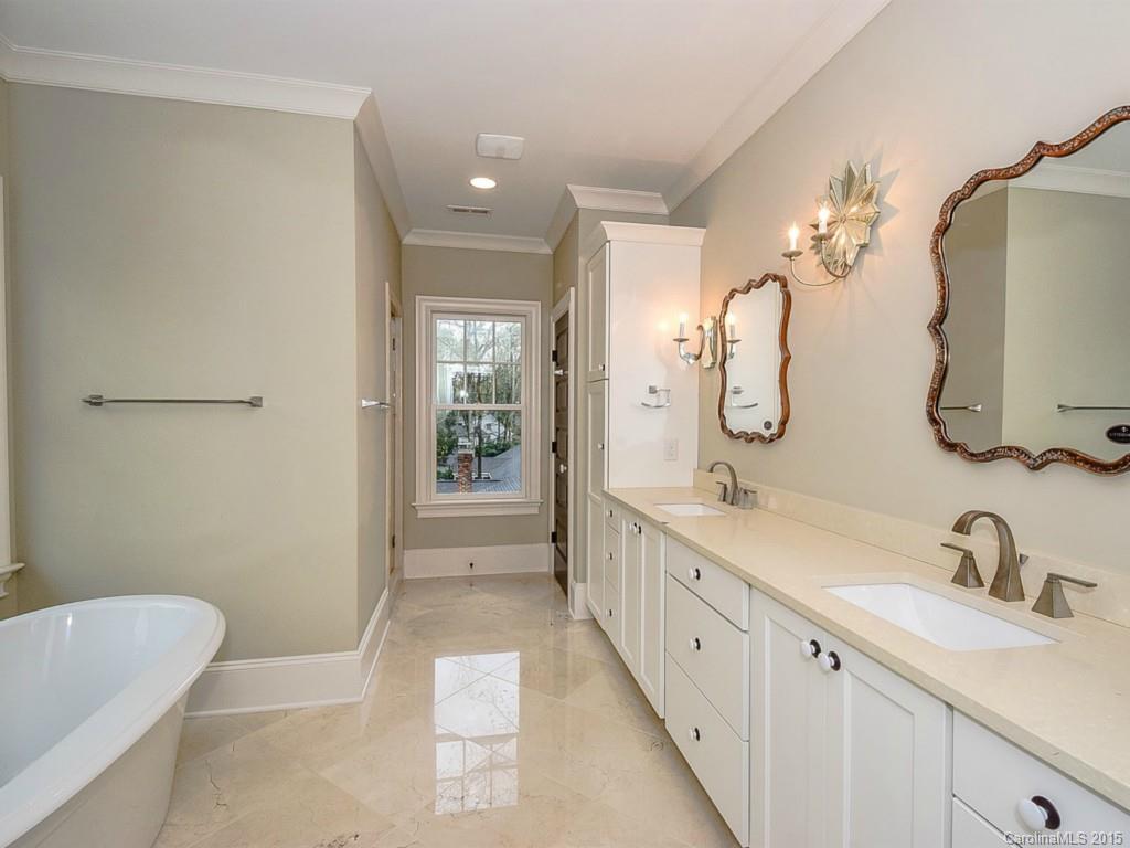 522 Ashworth Road Charlotte, NC 28211 - Photo 14 of 24 a spacious bathroom with a double vanity sink mirror and bathtub