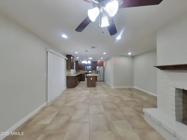 a view of a livingroom with a kitchen