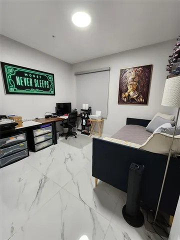 a view of a workspace with furniture